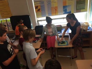 Students use a model to explain the setting of Jacob Have I Loved by Katherine Patterson.
