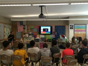 One student team has the class play an interactive Kahoot! quiz.